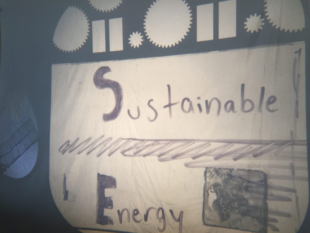 The words Sustainable Energy is written in ink with abstract lines between them and a block beside `"Energy.` A solar panel appears in a circle to the left. The shadow of a sun is above the solar panel.